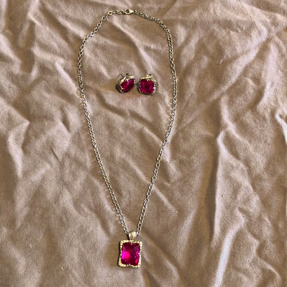 Charriol white gold and pink sapphire necklace and earring set.